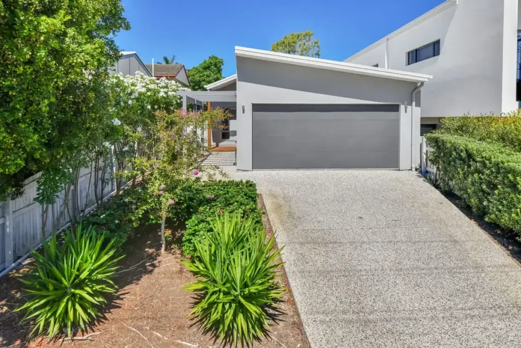 Front of the house with driveway, lock-up garage and front garden