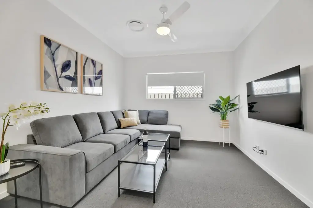 Separate media room with 65-inch Smart TV and modular lounge