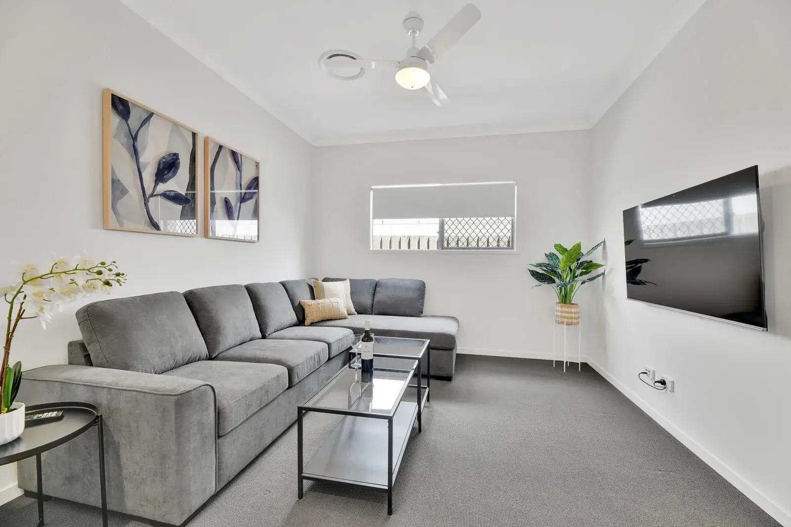 Separate media room with 65-inch Smart TV and modular lounge